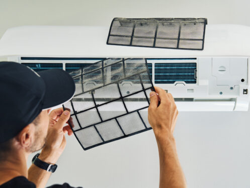 HVAC tech removing mini split filter